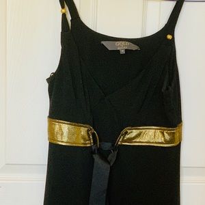 Versatile black sleeveless top with gold stripe